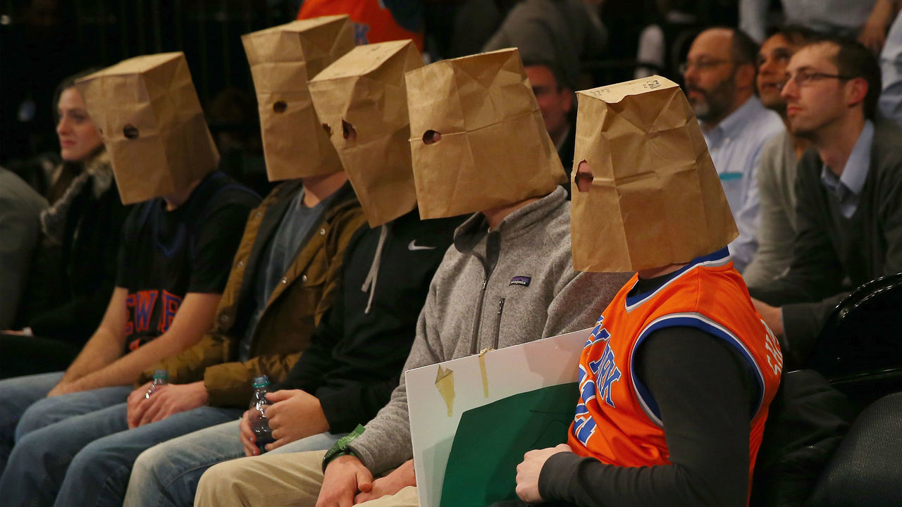 NEW YORK, NY - JANUARY 08: New York Knicks fans wear bags over their heads and react as the New York Knicks lose at Madison Square Garden on January 8, 2015 in New York City.The Houston Rockets defeated the New York Knicks 120-96. NOTE TO USER: User expressly acknowledges and agrees that, by downloading and/or using this photograph, user is consenting to the terms and conditions of the Getty Images License Agreement.