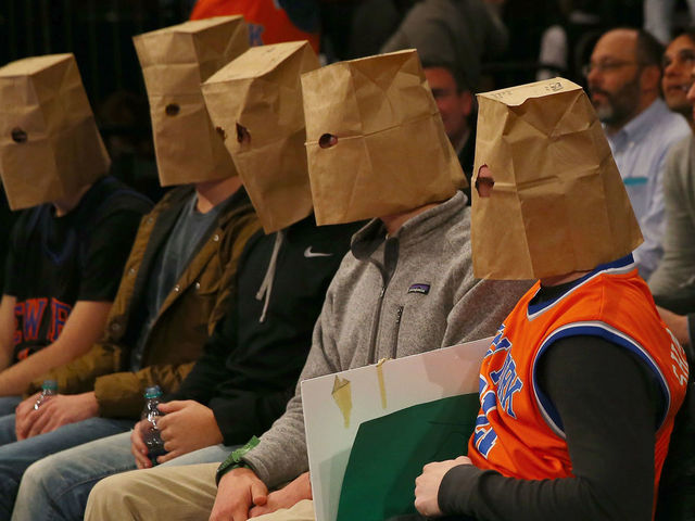 NEW YORK, NY - JANUARY 08: New York Knicks fans wear bags over their heads and react as the New York Knicks lose at Madison Square Garden on January 8, 2015 in New York City.The Houston Rockets defeated the New York Knicks 120-96. NOTE TO USER: User expressly acknowledges and agrees that, by downloading and/or using this photograph, user is consenting to the terms and conditions of the Getty Images License Agreement.