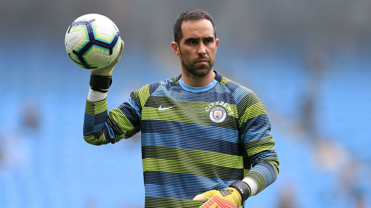 MANCHESTER, ENGLAND - AUGUST 19: Man City goalkeeper Claudio Bravo warms up ahead of the Premier League match between Manchester City and Huddersfield Town at the Etihad Stadium on August 19, 2018 in Manchester, England.