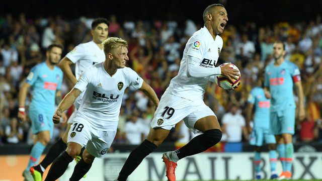 VALENCIA, SPAIN - AUGUST 20: Rodrigo Moreno Machado of Valencia celebrates with Daniel Wass of Valencia after scoring their side's first goal during the La Liga match between Valencia CF and Club Atletico de Madrid at Estadio Mestalla on August 20, 2018 in Valencia, Spain.