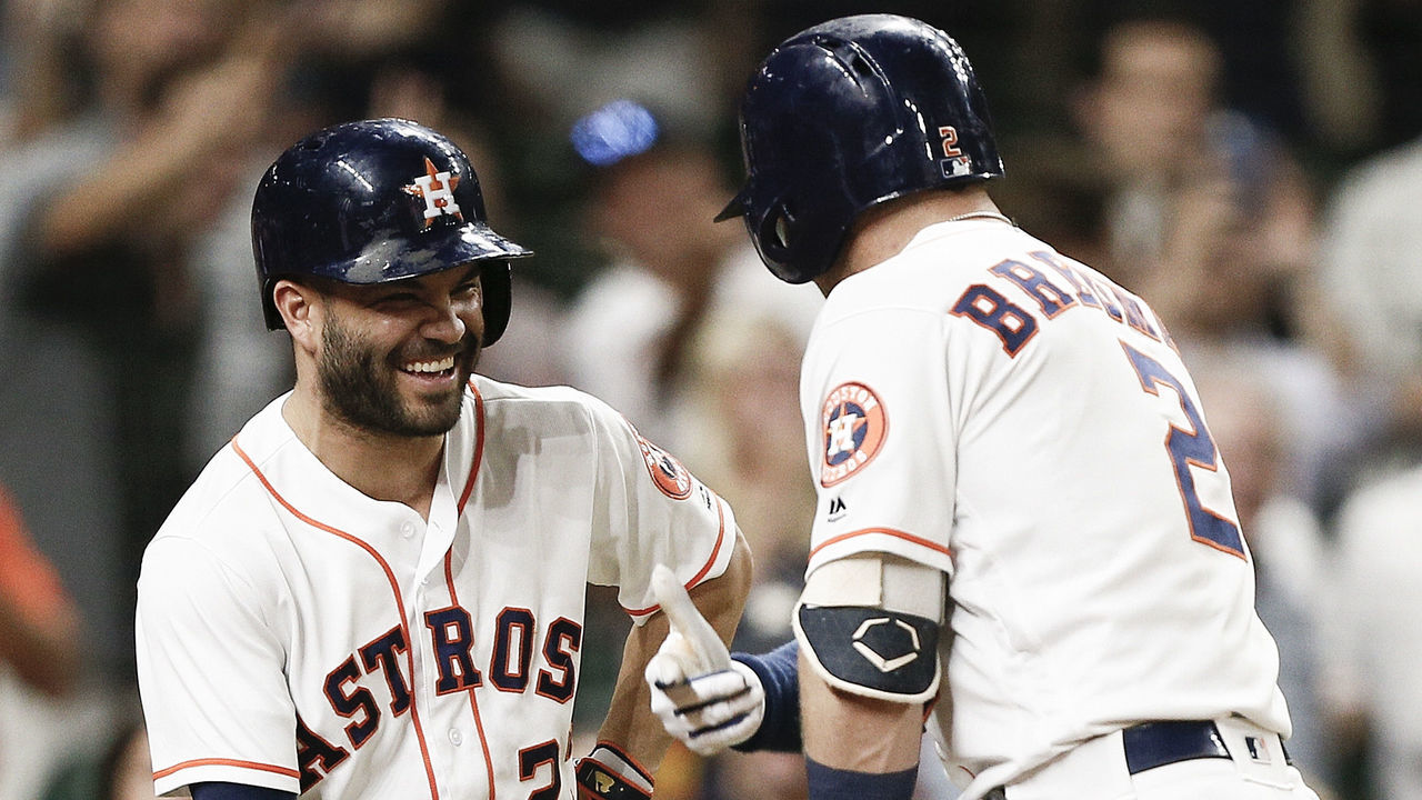 HOUSTON, TX - JULY 10: Alex Bregman #2 of the Houston Astros celebrates with Jose Altuve #27 after hitting a home run in the seventh inning against the Oakland Athletics at Minute Maid Park on July 10, 2018 in Houston, Texas.