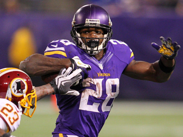 MINNEAPOLIS, MN - NOVEMBER 7: Adrian Peterson #28 of the Minnesota Vikings out runs DeAngelo Hall #23 of the Washington Redskins on November 7, 2013 at Mall of America Field at the Hubert Humphrey Metrodome in Minneapolis, Minnesota.