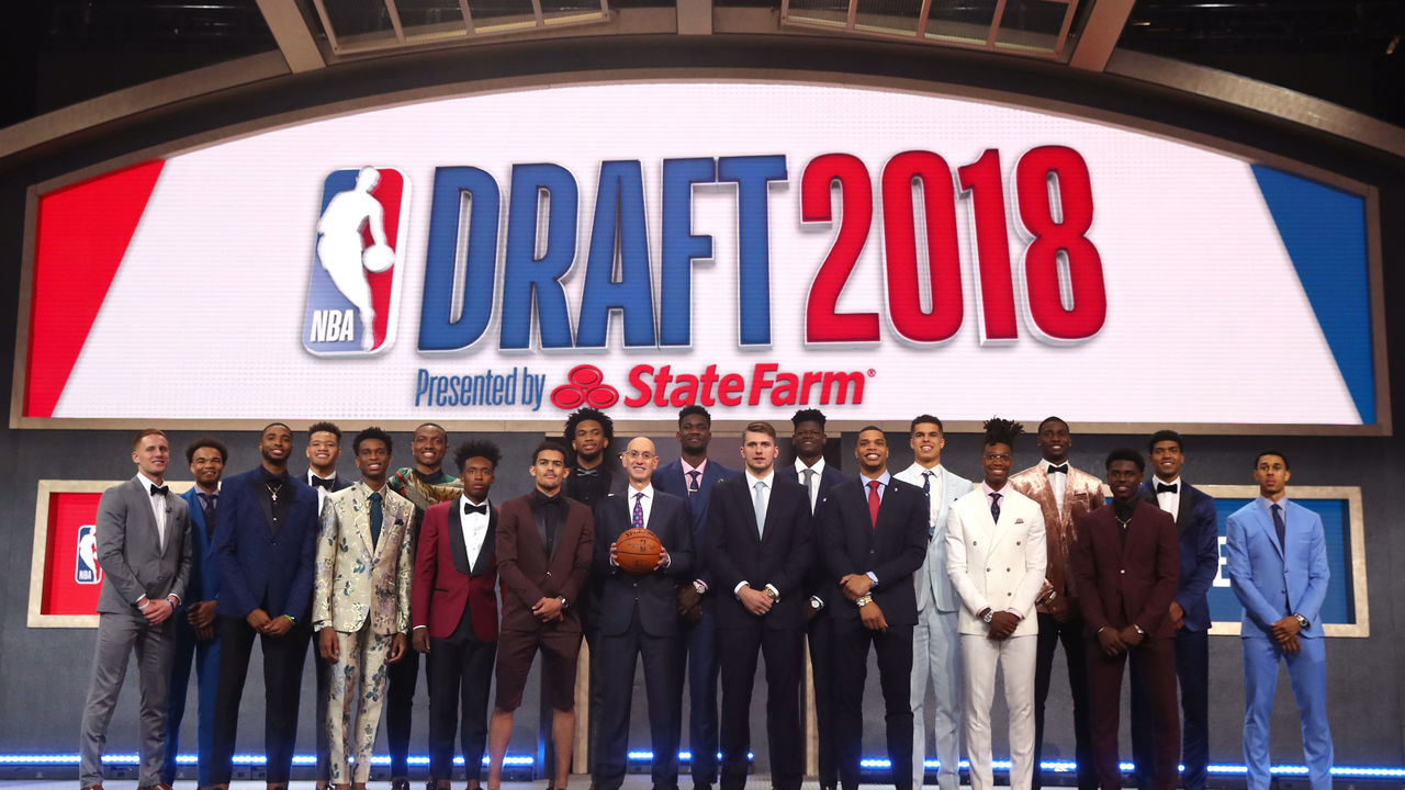 NEW YORK, NY - JUNE 21: NBA Commissioner Adam Silver poses with (L-R) Donte DiVincenzo, Jerome Robinson, Mikal Bridges, Kevin Knox, Shai Gilgeous-Alexander, Wendell Carter Jr., Collin Sexton, Marvin Bagley III, Trae Young, Deandre Ayton, Luka Doncic, Miles Bridges, Michael Porter Jr., Lonnie Walker IV, Jaren Jackson, Aaron Holiday, Chandler Hutchison and Zhaire Smith pose for a photo before the 2018 NBA Draft at the Barclays Center on June 21, 2018 in the Brooklyn borough of New York City.