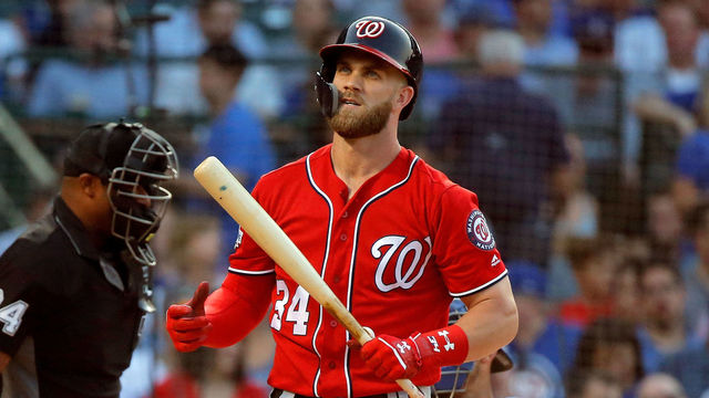 CHICAGO, IL - AUGUST 12: Bryce Harper #34 of the Washington Nationals reacts after a swinging strike two against the Chicago Cubs during the first inning at Wrigley Field on August 12, 2018 in Chicago, Illinois. The Chicago Cubs won 4-3.