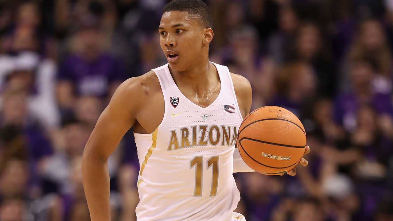 PHOENIX, AZ - DECEMBER 05: Ira Lee #11 of the Arizona Wildcats handles the ball during the second half of the college basketball game against the Texas A&M Aggies at Talking Stick Resort Arena on December 5, 2017 in Phoenix, Arizona. The Wildcats defeated the Aggies 67-64.