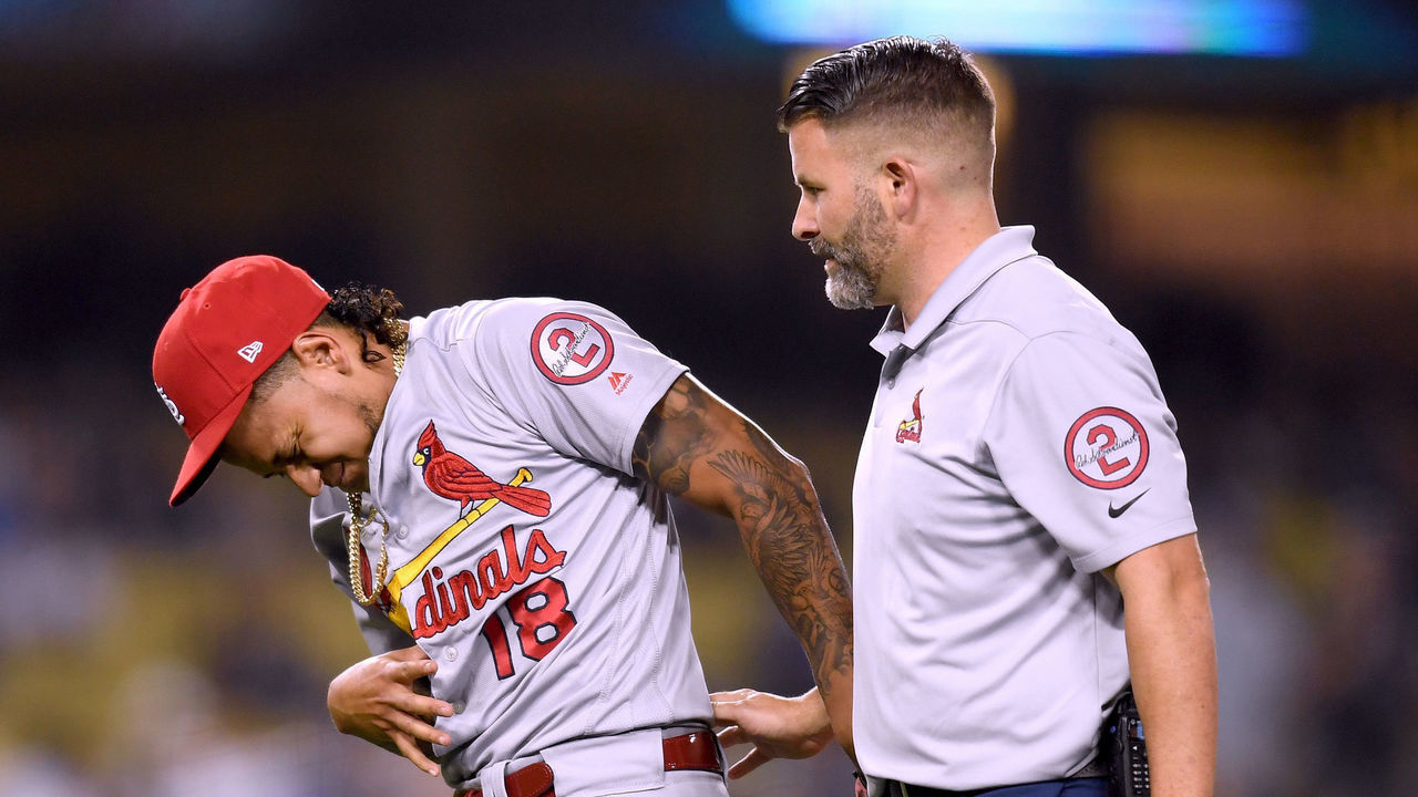 LOS ANGELES, CA - AUGUST 21: Carlos Martinez #18 of the St. Louis Cardinals reacts as he leaves the game after he was hit by a ball off the bat of Joc Pederson #31 of the Los Angeles Dodgers during the eighth inning at Dodger Stadium on August 21, 2018 in Los Angeles, California.