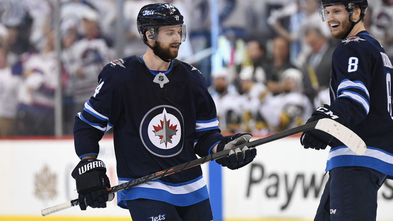 WINNIPEG, MB - MAY 20: Josh Morrissey #44 of the Winnipeg Jets celebrates with Jacob Trouba #8 after scoring a first period goal against the Vegas Golden Knights in Game Five of the Western Conference Finals during the 2018 NHL Stanley Cup Playoffs at Bell MTS Place on May 20, 2018 in Winnipeg, Canada.