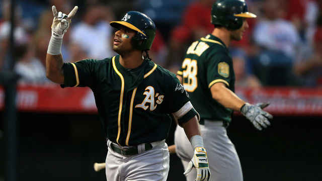 ANAHEIM, CA - AUGUST 10: Matt Olson #28 congratulates Khris Davis #2 of the Oakland Athletics after his two-run homerun during the first inning of a game against the Los Angeles Angels of Anaheim at Angel Stadium on August 10, 2018 in Anaheim, California.