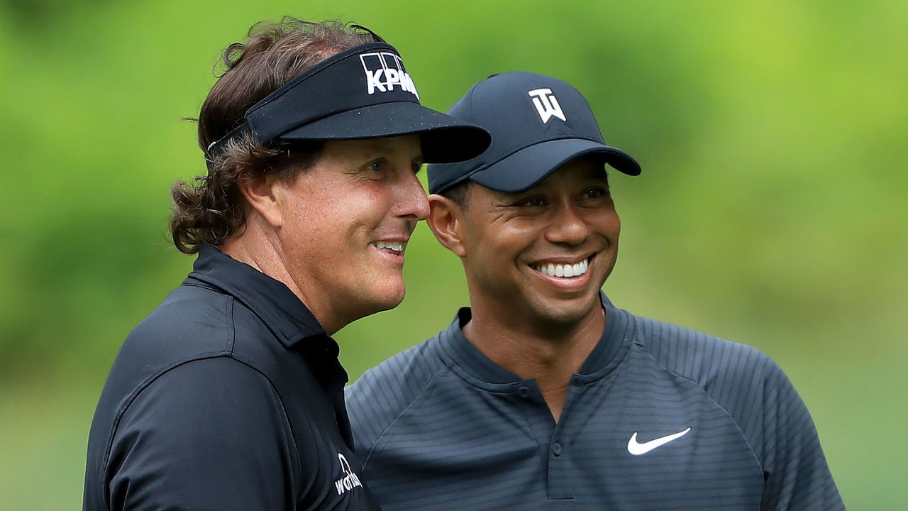 AKRON, OH - AUGUST 01: Phil Mickelson (L) and Tiger Woods smile during a practice round prior to the World Golf Championships-Bridgestone Invitational at Firestone Country Club South Course on August 1, 2018 in Akron, Ohio.