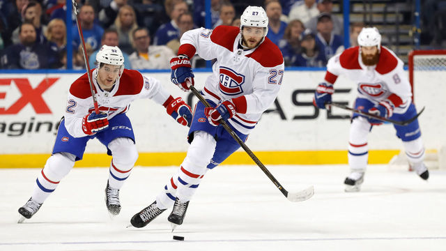TAMPA, FL - DECEMBER 28: Alex Galchenyuk #27 of the Montreal Canadiens brings the puck up in front of Jonathan Drouin #92 against the Tampa Bay Lightning during the first period at Amalie Arena on December 28, 2017 in Tampa, Florida.
