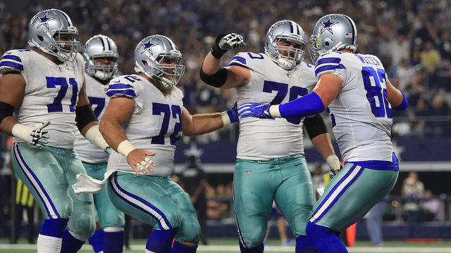 ARLINGTON, TX - SEPTEMBER 10: La'el Collins #71 of the Dallas Cowboys, Travis Frederick #72 of the Dallas Cowboys, and Zack Martin #70 of the Dallas Cowboys celebrate the touchdown by Jason Witten #82 of the Dallas Cowboys in the first half of a game at AT&T Stadium on September 10, 2017 in Arlington, Texas.