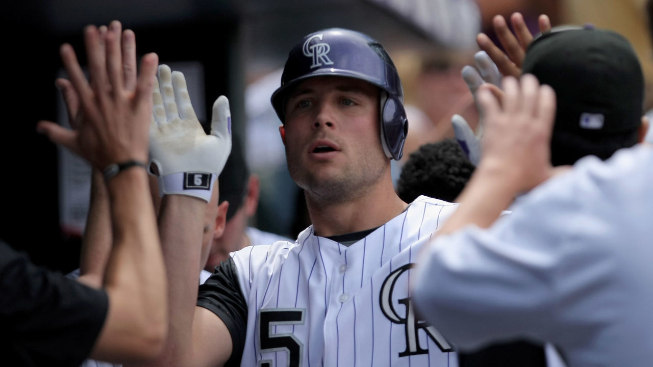 DENVER - JULY 20: Matt Holliday #5 of the Colorado Rockies is welcomed back to the duggout after his solo homerun off of starting pitcher Zach Duke #57 of the Pittsburgh Pirates to give the Rockies 6-3 lead in the fifth inning at Coors Field on July 20, 2008 in Denver, Colorado.