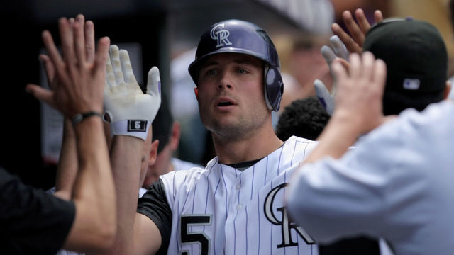 DENVER - JULY 20: Matt Holliday #5 of the Colorado Rockies is welcomed back to the duggout after his solo homerun off of starting pitcher Zach Duke #57 of the Pittsburgh Pirates to give the Rockies 6-3 lead in the fifth inning at Coors Field on July 20, 2008 in Denver, Colorado.
