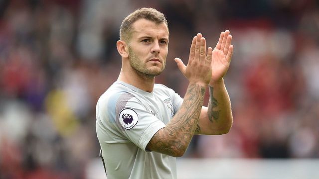 West Ham United's English midfielder Jack Wilshere applauds supporters as he leaves the pitch after the English Premier League football match between Liverpool and West Ham United at Anfield in Liverpool, north west England on August 12, 2018. - Liverpool won the game 4-0.