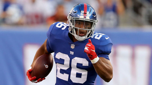 EAST RUTHERFORD, NJ - AUGUST 09: Saquon Barkley #26 of the New York Giants carries the bal in the first quarter against the Cleveland Browns during their preseason game on August 9,2018 at MetLife Stadium in East Rutherford, New Jersey.