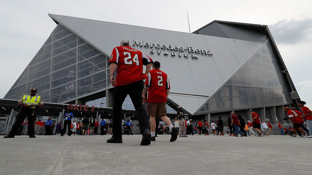 ATLANTA, GA - AUGUST 26: Fans enter the gates prior to the game between the Atlanta Falcons and the Arizona Cardinals at Mercedes-Benz Stadium on August 26, 2017 in Atlanta, Georgia.