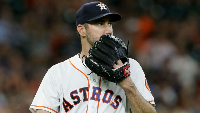 HOUSTON, TX - AUGUST 14: Justin Verlander #35 of the Houston Astros walks off the mound after striking out Pat Valaika #4 of the Colorado Rockies to end the second inning at Minute Maid Park on August 14, 2018 in Houston, Texas.