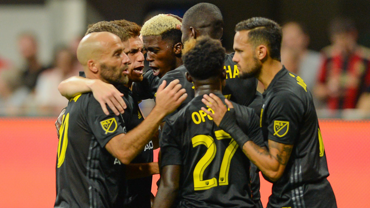 ATLANTA, GA AUGUST 19: Columbus forward Gyasi Zardes (center) celebrates with teammates after scoring a goal during the match between Atlanta United and Columbus Crew on August 19th, 2018 at Mercedes-Benz Stadium in Atlanta, GA. Atlanta United FC defeated Columbus Crew SC by a score of 3 - 1.