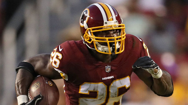 LANDOVER, MD - AUGUST 24: Running back Adrian Peterson #26 of the Washington Redskins rushes against the Denver Broncos in the first quarter during a preseason game at FedExField on August 24, 2018 in Landover, Maryland.