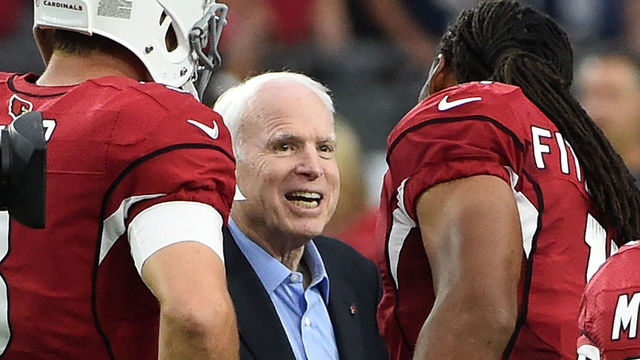 GLENDALE, AZ - SEPTEMBER 11: Wide receiver Larry Fitzgerald #11 and Carson Palmer #3 of the Arizona Cardinals shakes hands with United States Senator John McCain prior to the coin flip before the start of a game against the New England Patriots at University of Phoenix Stadium on September 11, 2016 in Glendale, Arizona.