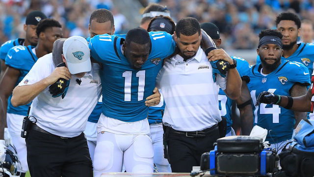 JACKSONVILLE, FL - AUGUST 25: Marqise Lee #11 of the Jacksonville Jaguars is helped off the field after an injury during a preseason game against the Atlanta Falconsat TIAA Bank Field on August 25, 2018 in Jacksonville, Florida.