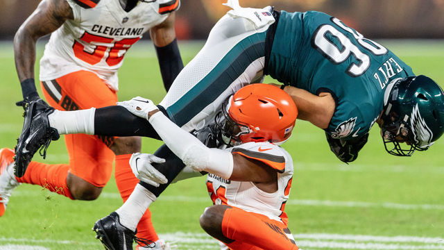 CLEVELAND, OH - AUGUST 23: Denzel Ward #21 of the Cleveland Browns tackles Zach Ertz #86 of the Philadelphia Eagles during the first half of a preseason game at FirstEnergy Stadium on August 23, 2018 in Cleveland, Ohio.