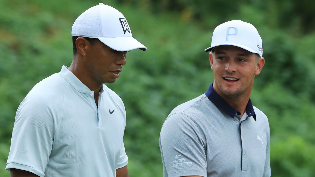 ST. LOUIS, MO - AUGUST 07: (L-R) Tiger Woods of the United States and Bryson DeChambeau of the United States walk off the second tee during a practice round prior to the 2018 PGA Championship at Bellerive Country Club on August 7, 2018 in St. Louis, Missouri.