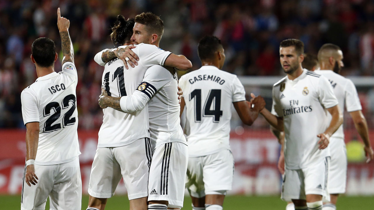 Real Madrid's Welsh forward Gareth Bale (2L) celebrates his goal with Real Madrid's Spanish defender Sergio Ramos during the Spanish league football match between Girona FC and Real Madrid CF at the Montilivi stadium in Girona on August 26, 2018.