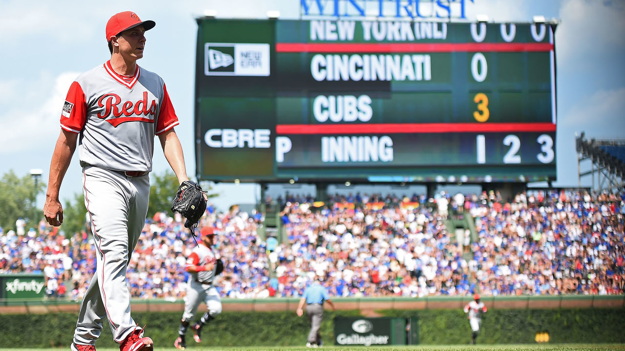 CHICAGO, IL - AUGUST 26: Homer Bailey #34 of the Cincinnati Reds walks to the dugout after the first inning against the Chicago Cubs at Wrigley Field on August 26, 2018 in Chicago, Illinois. All players across MLB will wear nicknames on their backs as well as colorful, non traditional uniforms featuring alternate designs inspired by youth-league uniforms during Players Weekend.
