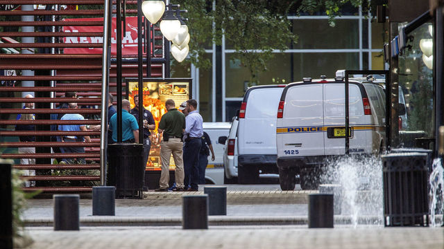 JACKSONVILLE, FL - AUGUST 26: Jacksonville Sheriff's officers investigate the shooting at Jacksonville Landing on August 26, 2018 in Jacksonville, Florida. A shooting rampage during a Madden 19 video game tournament at the site claimed four lives, with several others wounded, according to published reports.