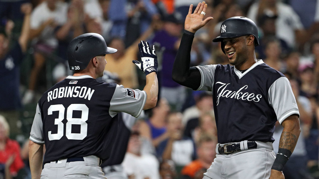 BALTIMORE, MD - AUGUST 26: Aaron Hicks #31 and Shane Robinson #38 of the New York Yankees celebrate after both scoring on an RBI double hit by Miguel Andujar (not pictured) against the Baltimore Orioles during the third inning at Oriole Park at Camden Yards on August 26, 2018 in Baltimore, Maryland.