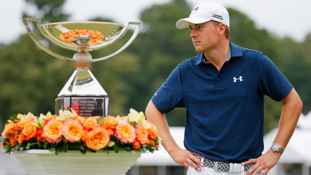 ATLANTA, GA - SEPTEMBER 27: Jordan Spieth of the United States poses on the 18th green after winning both the TOUR Championship By Coca-Cola and the FedExCup at East Lake Golf Club on September 27, 2015 in Atlanta, Georgia