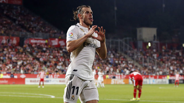 Real Madrid's Welsh forward Gareth Bale celebrates scoring his team's third goal during the Spanish league football match between Girona FC and Real Madrid CF at the Montilivi stadium in Girona on August 26, 2018.