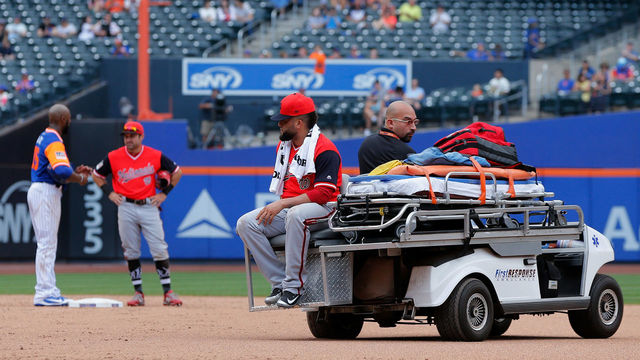 NEW YORK, NY - AUGUST 26: Kelvin Herrera #40 of the Washington Nationals is taken off the field after an injury during the ninth inning against the New York Mets at Citi Field on August 26, 2018 in the Flushing neighborhood of the Queens borough of New York City. Players are wearing special jerseys with their nicknames on them during Players' Weekend.