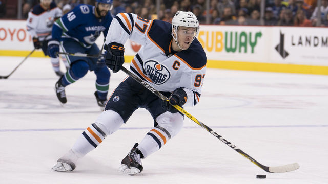 VANCOUVER, BC - MARCH 29: Connor McDavid #97 of the Edmonton Oilers skates with the puck in NHL action against the Vancouver Canucks on March, 29, 2018 at Rogers Arena in Vancouver, British Columbia, Canada.