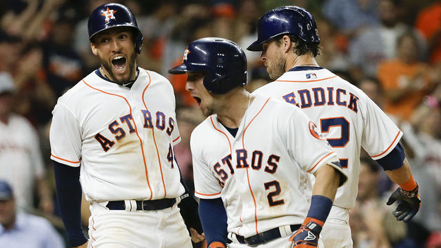 HOUSTON, TX - AUGUST 27: Alex Bregman #2 of the Houston Astros celebrates with George Springer #4 and Josh Reddick #22 after hitting a three-run home run against the Oakland Athletics in the eighth inning at Minute Maid Park on August 27, 2018 in Houston, Texas.