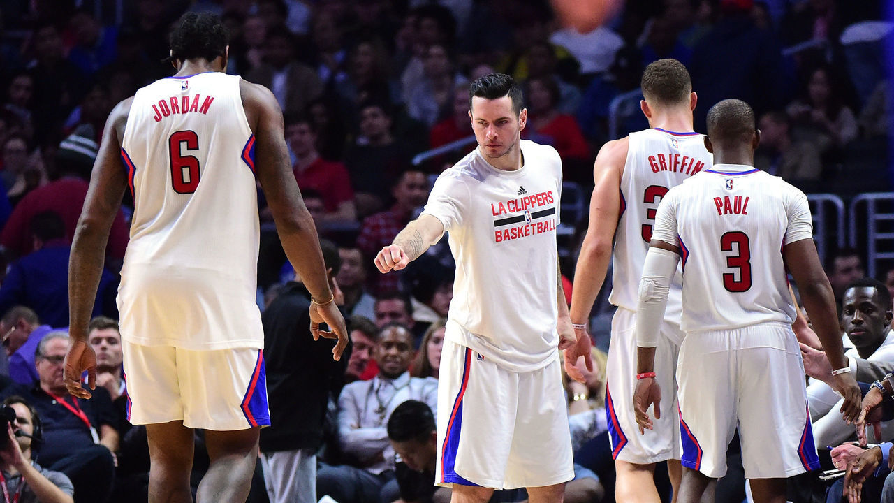 LOS ANGELES, CA - DECEMBER 07: J.J. Redick #4 of the LA Clippers greets Blake Griffin #32, Chris Paul #3 and DeAndre Jordan #6 as they leave the game during a 115-98 Golden State Warriors win at Staples Center on December 7, 2016 in Los Angeles, California.