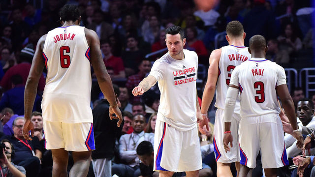 LOS ANGELES, CA - DECEMBER 07: J.J. Redick #4 of the LA Clippers greets Blake Griffin #32, Chris Paul #3 and DeAndre Jordan #6 as they leave the game during a 115-98 Golden State Warriors win at Staples Center on December 7, 2016 in Los Angeles, California.