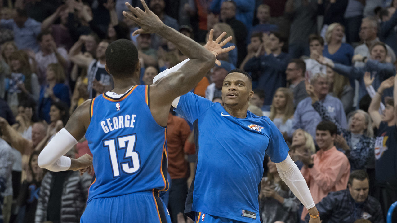 OKLAHOMA CITY, OK - NOVEMBER 22: Paul George #13 of the Oklahoma City Thunder and Russell Westbrook #0 of the Oklahoma City Thunder celebrate during the second half of a NBA game against the Golden State Warriors at the Chesapeake Energy Arena on November 22, 2017 in Oklahoma City, Oklahoma.