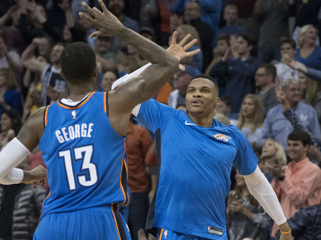 OKLAHOMA CITY, OK - NOVEMBER 22: Paul George #13 of the Oklahoma City Thunder and Russell Westbrook #0 of the Oklahoma City Thunder celebrate during the second half of a NBA game against the Golden State Warriors at the Chesapeake Energy Arena on November 22, 2017 in Oklahoma City, Oklahoma.