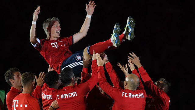 Team players of FC Bayern Munich celebrate the former Bayern Munich midfielder Bastian Schweinsteiger after the farewell match for Bastian Schweinsteiger between his former teams FC Bayern Munich and Chicago Fire in the stadium in Munich, southern Germany, on August 28, 2018.