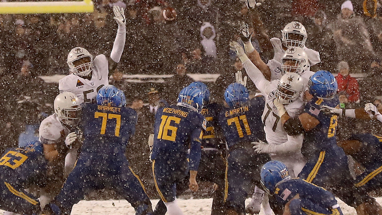PHILADELPHIA, PA - DECEMBER 09: Bennett Moehring #16 of the Navy Midshipmen attempts a field goal in the final seconds of the game but misses giving the win to the Army Black Knights on December 9, 2017 at Lincoln Financial Field in Philadelphia, Pennsylvania.The Army Black Knights defeated the Navy Midshipmen 14-13.
