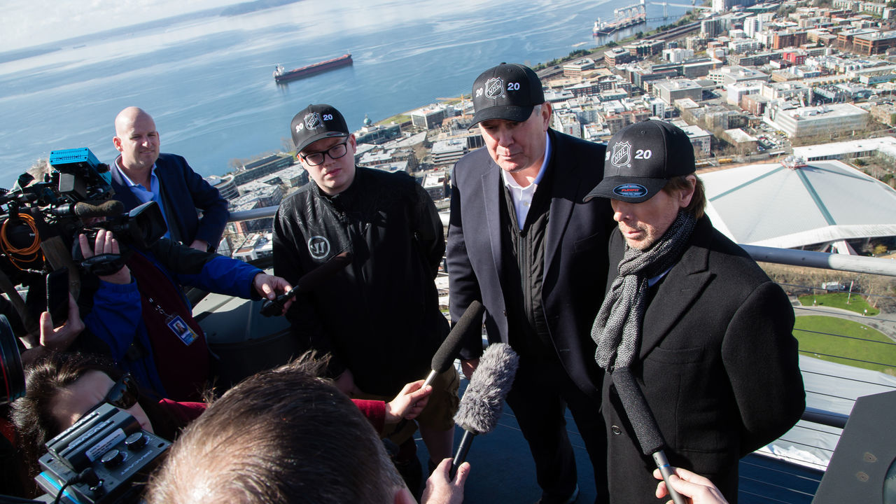 SEATTLE, WA - MARCH 1: Potential Seattle NHL franchise owners Tim Leiweke and Jerry Bruckheimer talk with the media on the top of the Space Needle with Key Arena in the background during the NHL Seattle season ticket deposit drive kickoff on Thursday, March 1, 2018 in Seattle, WA.