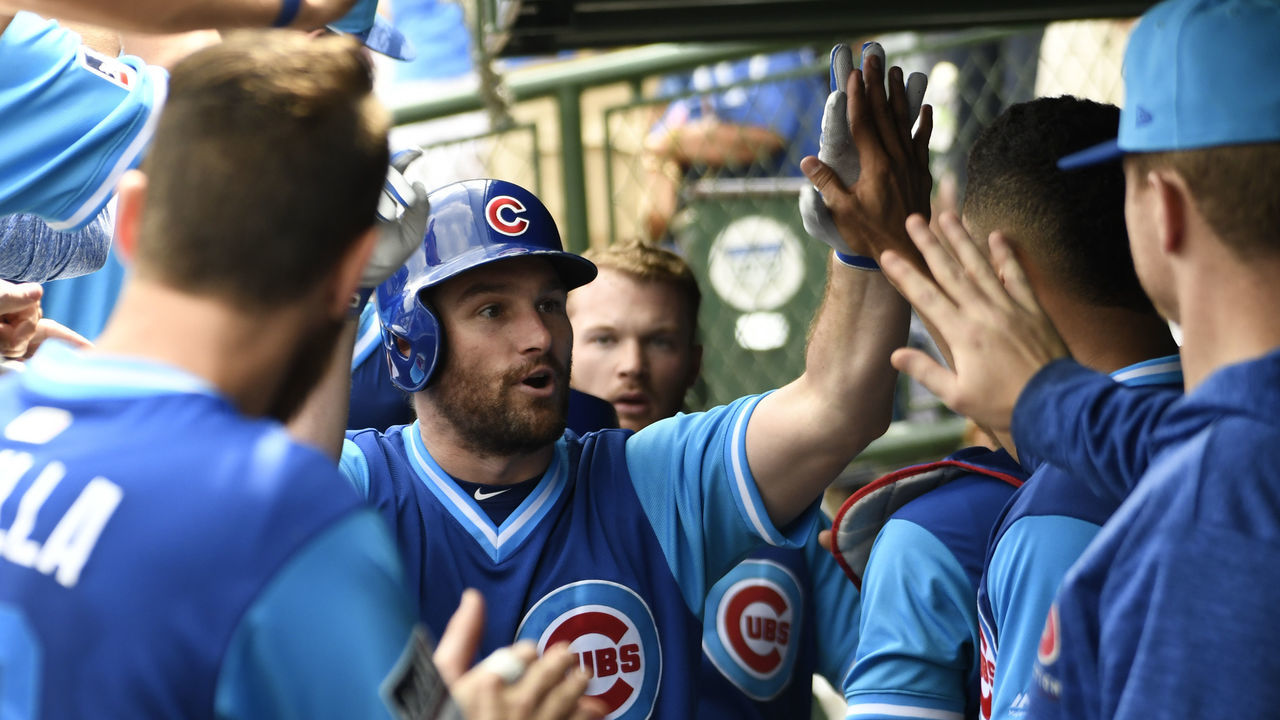 CHICAGO, IL - AUGUST 25: Daniel Murphy #3 of the Chicago Cubs is greeted by his teammates after hitting a two-run home run against the Cincinnati Reds during the second inning on August 25, 2018 at Wrigley Field in Chicago, Illinois.