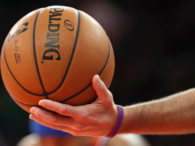 NEW YORK, NY - DECEMBER 08: A ref hands off the ball during the game between the New York Knicks and the Boston Celtics at Madison Square Garden on December 8, 2013 in New York City.