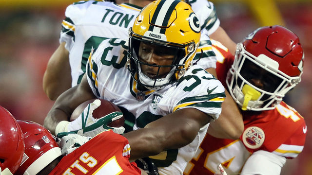 KANSAS CITY, MO - AUGUST 30: Running back Aaron Jones #33 of the Green Bay Packers carries the ball during the preseason game against the Kansas City Chiefs at Arrowhead Stadium on August 30, 2018 in Kansas City, Missouri.