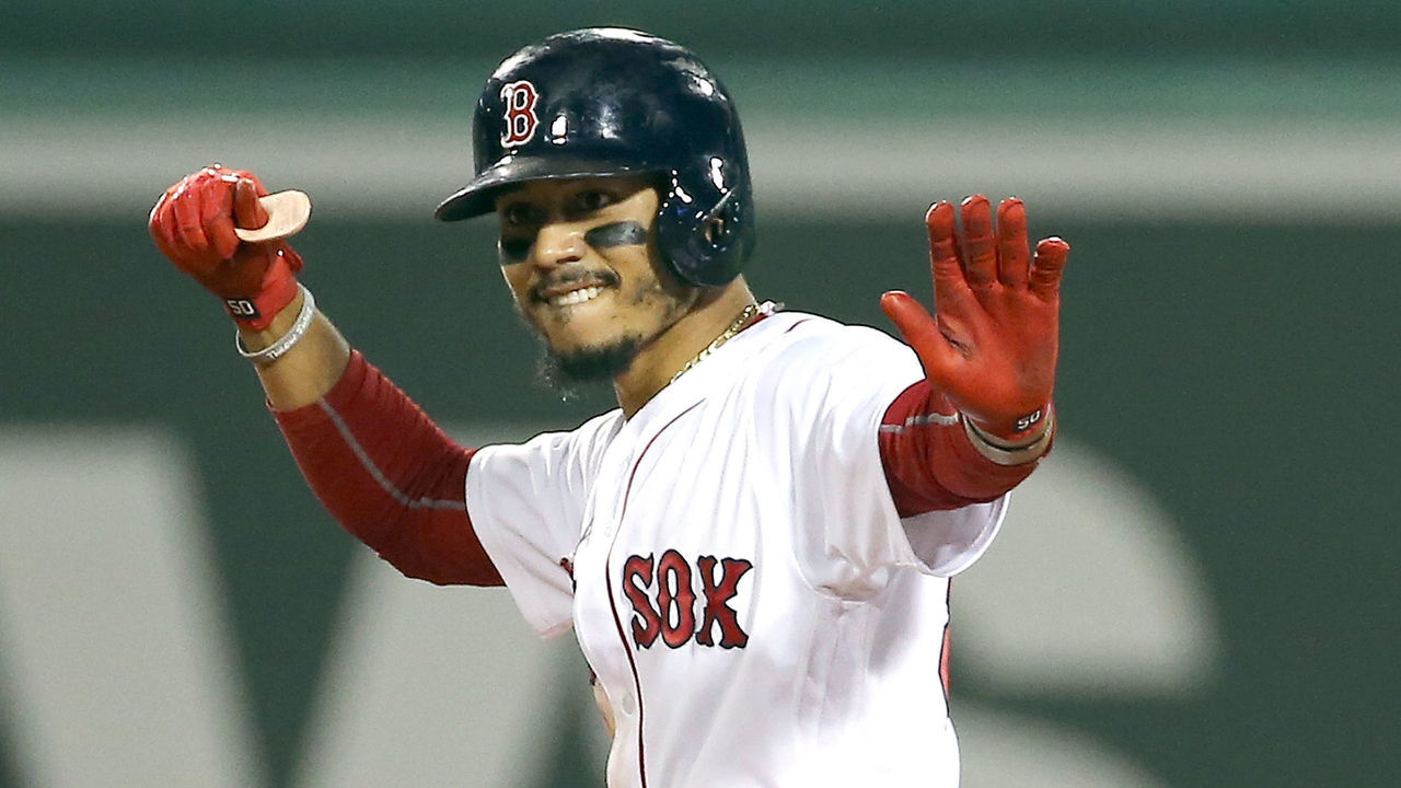 BOSTON, MA - AUGUST 29: Mookie Betts #50 of the Boston Red Sox reacts after driving in two runs on a double for the lead against the Miami Marlins in the seventh inning at Fenway Park on August 29, 2018 in Boston, Massachusetts.