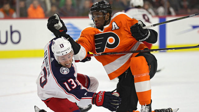 PHILADELPHIA, PA - MARCH 15: Wayne Simmonds #17 of the Philadelphia Flyers checks Cam Atkinson #13 of the Columbus Blue Jackets during the second period at Wells Fargo Center on March 15, 2018 in Philadelphia, Pennsylvania.