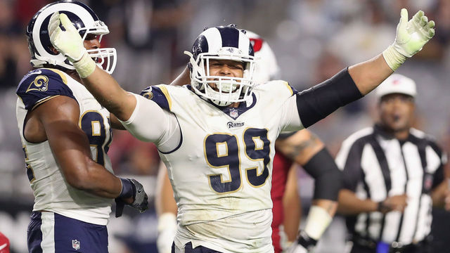 GLENDALE, AZ - DECEMBER 03: Defensive end Aaron Donald #99 of the Los Angeles Rams reacts after a tackle against the Arizona Cardinals during the second half of the NFL game at the University of Phoenix Stadium on December 3, 2017 in Glendale, Arizona. The Rams defeated the Cardinals 32-16.