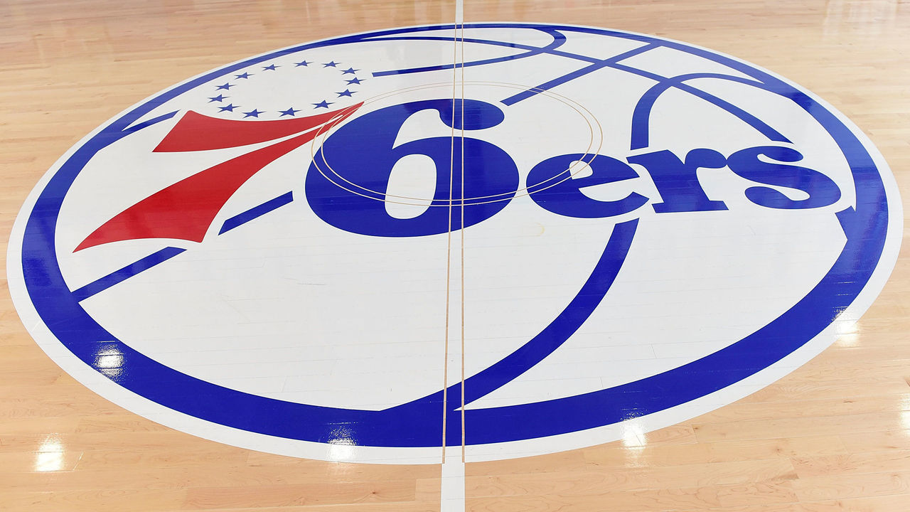 CAMDEN, NJ - SEPTEMBER 09: Interior of 76ers logo painted on wooden floor at Sixers Training Complex in Camden, New Jersey during the Julius Erving Youth Basketball Clinic on September 9, 2017